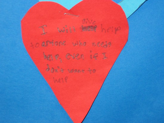 A student-created heart A cut out heart with words