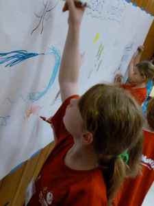 Kids in Crazy Crafts work on the God's creation mural