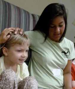 A crew leader from VBC blesses one of her crew