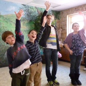 1st and 6th graders work together in the Games Workshop