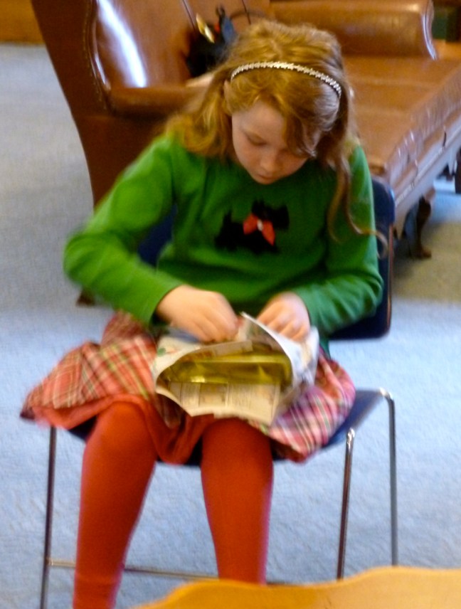 carefully unwrapping her Bible