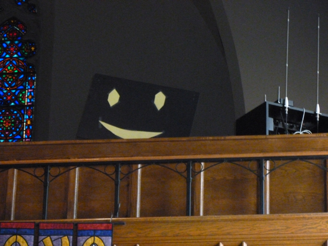 the mysterious smiley face in the balconey