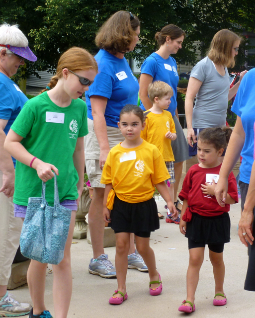 A Grad Group member helps lead kids into the castle