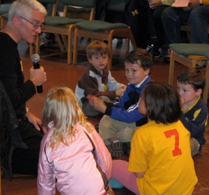 Children have a time with the pastor at church
