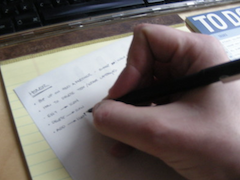 a person writes a to-do list